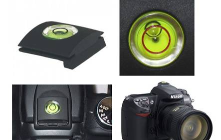 There is a camera with a circular bubble level on its surface.